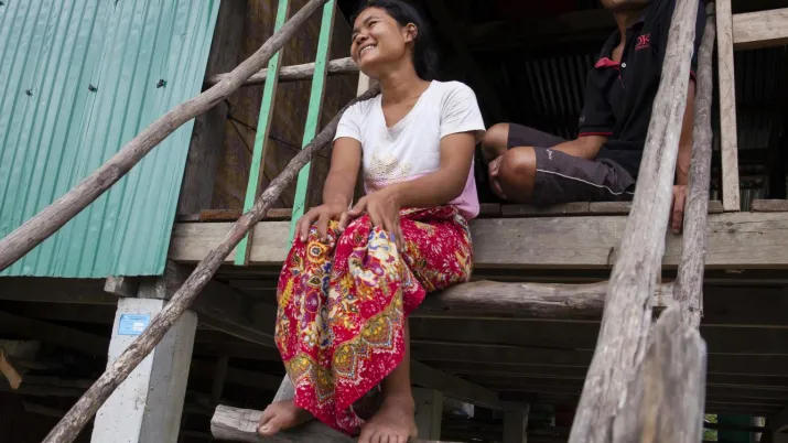 Couple in front of their house, Cambodia